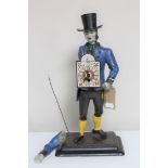 An antique Continental metal figural clock - Man with top hat