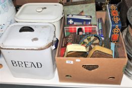 Two enamel bread bins and a box of various vintage tins