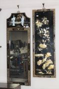 A Japanese lacquered framed hall mirror and a wall panel