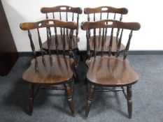 A set of four beech spindle back kitchen chairs