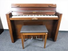 A mahogany cased Eavestaff mini piano with stool