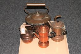 A tray of two antique copper kettles and two copper coffee pots