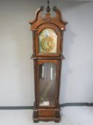 A reproduction Grandfather clock with pendulum and weights