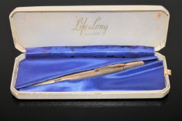 A cased propelling pencil stamped Life Long,