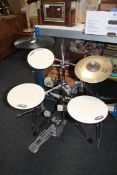 A DW smart practice drum set with a Stagg cymbal