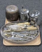 A tray of plated gallery tray containing various cutlery,
