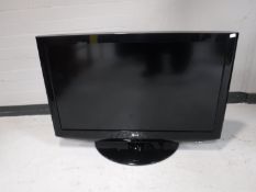 An LG 37" flatscreen TV with remote