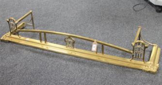 A good quality late Victorian brass fire curb