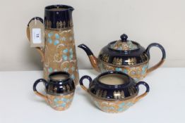 A four piece Royal Doulton Lambeth tea service