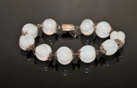 A silver and moonstone bracelet CONDITION REPORT: 19cm long.