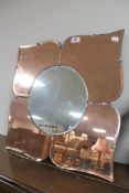 An early twentieth century frameless Art Deco two-tone mirror, together with a Robosapien robot,