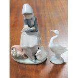 A Lladro figure of a lady with geese and another Lladro goose figure (2)