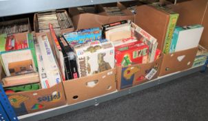 Four boxes containing a large quantity of board games, magazines,