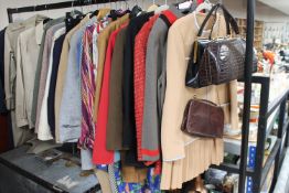 A part rail of lady's clothing including Harrods jacket, Aquascutum jackets,