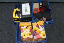 Three crates containing Millennium Dome experience items, Dartington crystal vase, Ritzenhoff mug,