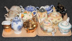 Two trays of various 20th century teapots and jugs
