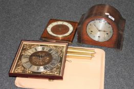 An oak cased Enfield mantel clock with silvered dial,