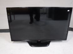 An LG 42" flatscreen TV with remote