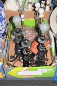 A box of various contemporary lamps and shades