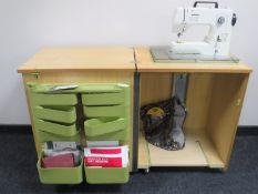 A Bernina electric sewing machine in teak cabinet