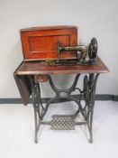 A mid 20th century Singer treadle sewing machine