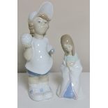 A Lladro figure of a boy with a tennis racket and another figure of a girl (2)