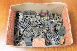 A box of vintage lead farm animals and accessories