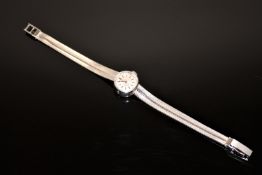 An 18ct white gold Omega De Ville lady's wrist watch, 21.2g gross.
