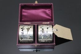 A fine pair of silver napkin rings, cased.