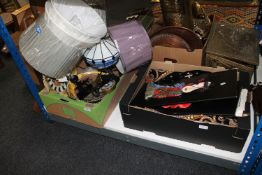 A box containing contemporary lamps and lamp shades, Tiffany style lamp, pottery plates etc,