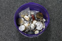 A tub containing wristwatches,