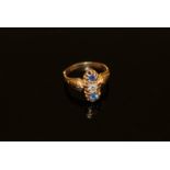 An 18ct gold sapphire and diamond three stone ring