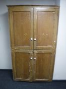 A rustic pine double door cupboard 113 cm x 200 cm x 47 cm.
