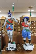 A pair of painted figural table lamps modelled as soldiers