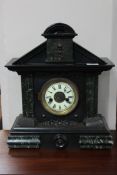 A late Victorian marble effect mantel clock