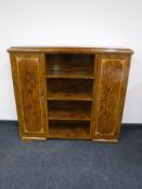 A continental mahogany bookcase with sentry doors