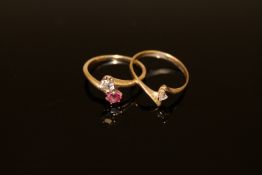 A diamond and ruby two stone ring,