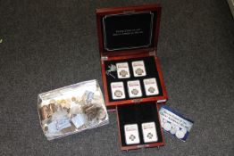 A boxed group of seven 'Silver Coins of the American Great Hoard',