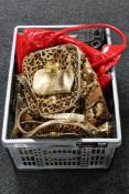 Two crates containing lady's handbags, ornaments, china, figures,