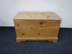 An antique style pine blanket box