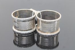 A matching pair of silver serviette rings (2)
