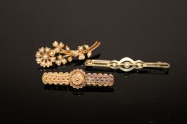Three 15ct gold brooches, two set with pearls, 8.