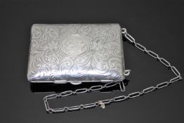 An engraved sterling silver lady's purse on chain with various compartments to include sovereign