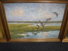 A gilt framed oil on canvas - ducks in flights