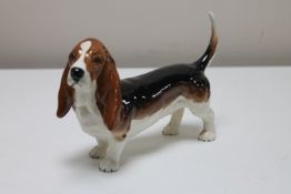A Beswick china figure - Bassett hound, gloss, height 12 cm, model 2045A.