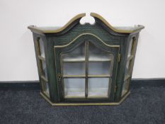 An antique style painted oak wall cabinet