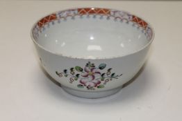 A late 18th century Newhall porcelain bowl, the base marked in puce cursive script 'N662'.