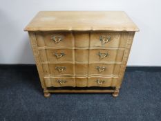 A continental light oak four drawer chest