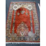 A fringed prayer rug of Kashan design