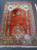 A fringed prayer rug of Kashan design